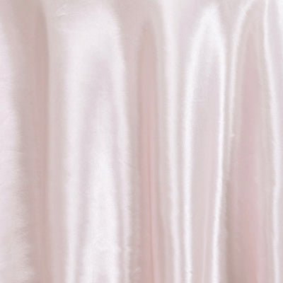 Soft pink satin fabric draping elegantly.
