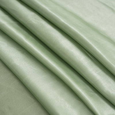 Soft green satin fabric with elegant drapes and smooth texture.
