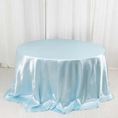 Light blue satin tablecloth on a round table
