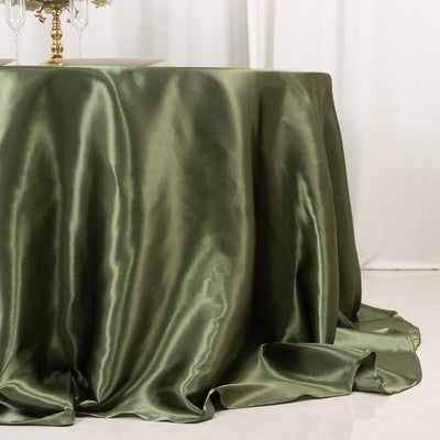 Elegant green satin tablecloth draping over a table.