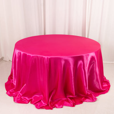 Bright pink satin tablecloth on a round table
