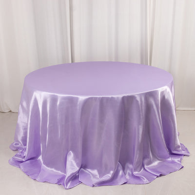 Round lavender satin tablecloth with elegant draping.