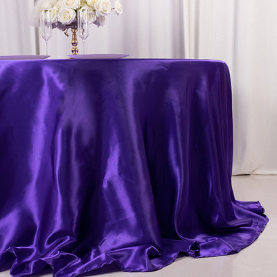 Purple satin tablecloth draped elegantly on a table.