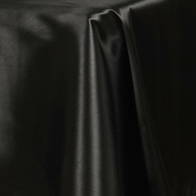 Black satin fabric draped smoothly, showcasing a sleek, elegant texture.