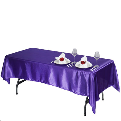Purple satin tablecloth with stylish table setting for elegant dining.