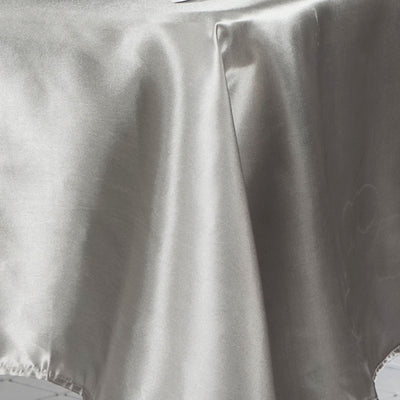 Silver satin fabric with a smooth, glossy texture.