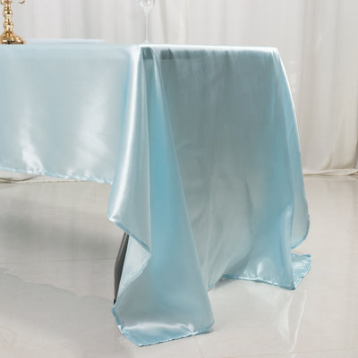 Light blue satin tablecloth draping elegantly over a table.