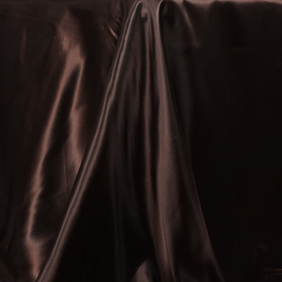 Silky brown fabric draped elegantly, showcasing its smooth texture and sheen.