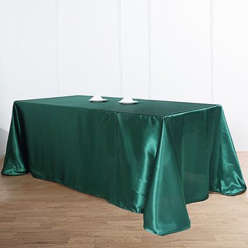 Elevate Your Event Decor with the Hunter Emerald Green Satin Seamless Rectangular Tablecloth 90"x132"
