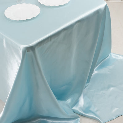 Shiny light blue tablecloth draping elegantly over a table