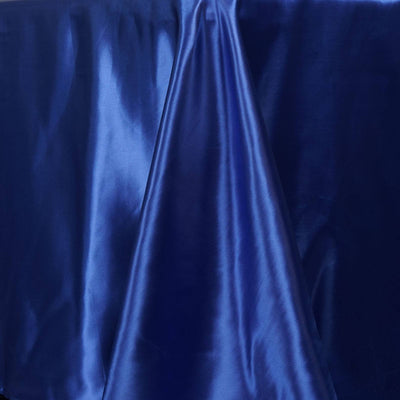 Deep blue satin fabric draped elegantly on a surface.