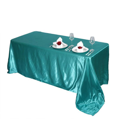 Turquoise satin tablecloth with elegant table setting