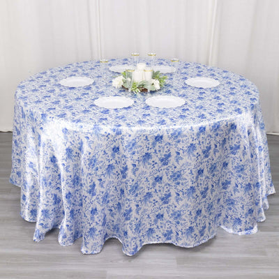 Round floral tablecloth in blue and white on a dining table.