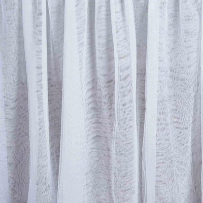 Sheer white fabric with soft texture and flowing drapes.