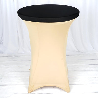 Black top cocktail table with a beige fitted cover