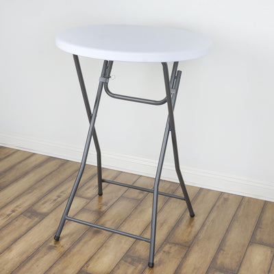 Round folding table with a white top and gray metal legs.
