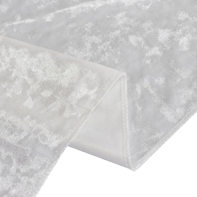 White textured fabric close-up showcasing intricate patterns and soft sheen.