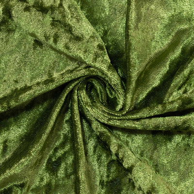 Green velvet fabric texture with elegant swirls and folds#whtbkgd