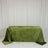 Green velvet tablecloth on rectangular table against white draped backdrop