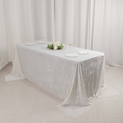 Elegant white tablecloth draped on a table with decorative elements.
