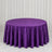 Purple velvet round tablecloth on a round table in a studio setting