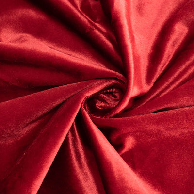 Red satin fabric swirl with glossy texture and folds#whtbkgd