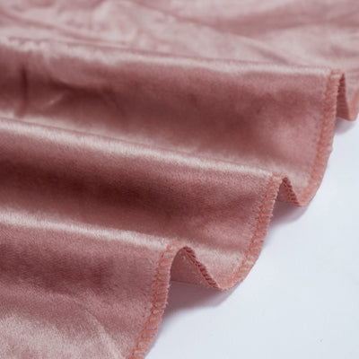 Rose pink satin fabric with scalloped edges and soft sheen