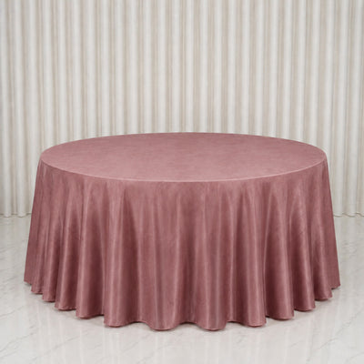 Dusty pink round tablecloth on a banquet table in a minimalist room
