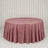 Dusty pink round tablecloth on a banquet table in a minimalist room