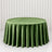 Round green velvet tablecloth on elegant dining table, studio backdrop