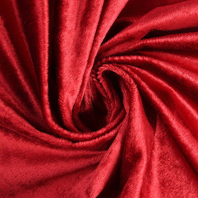 Luxurious red velvet fabric with a soft, smooth texture.