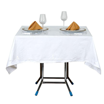 Dining table set with elegant tableware and wine glasses