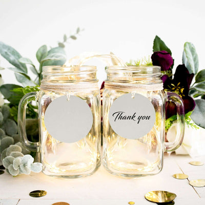 Thank you mason jars with fairy lights and greenery