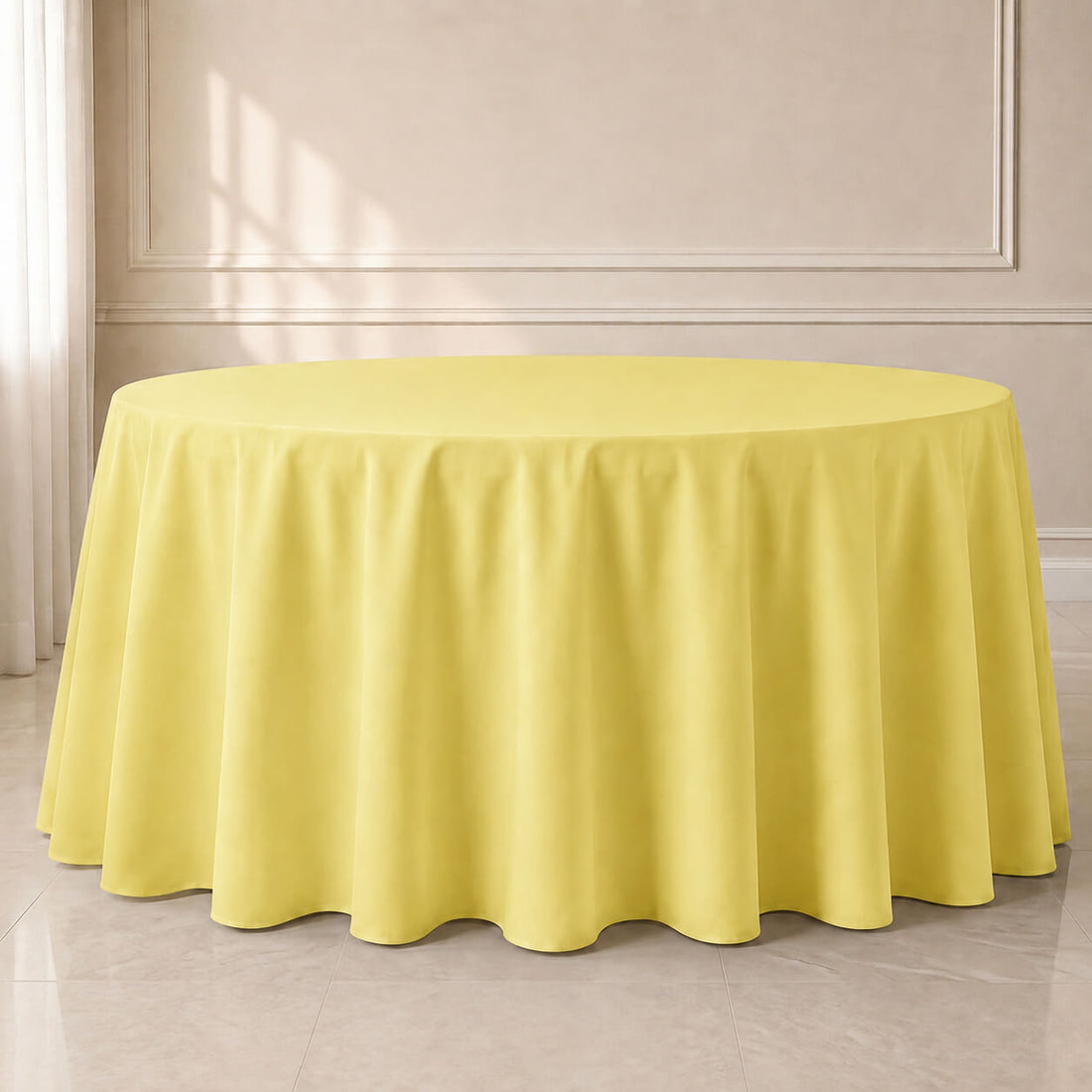 Yellow polyester round tablecloth, seamless and durable, perfect for any occasion.