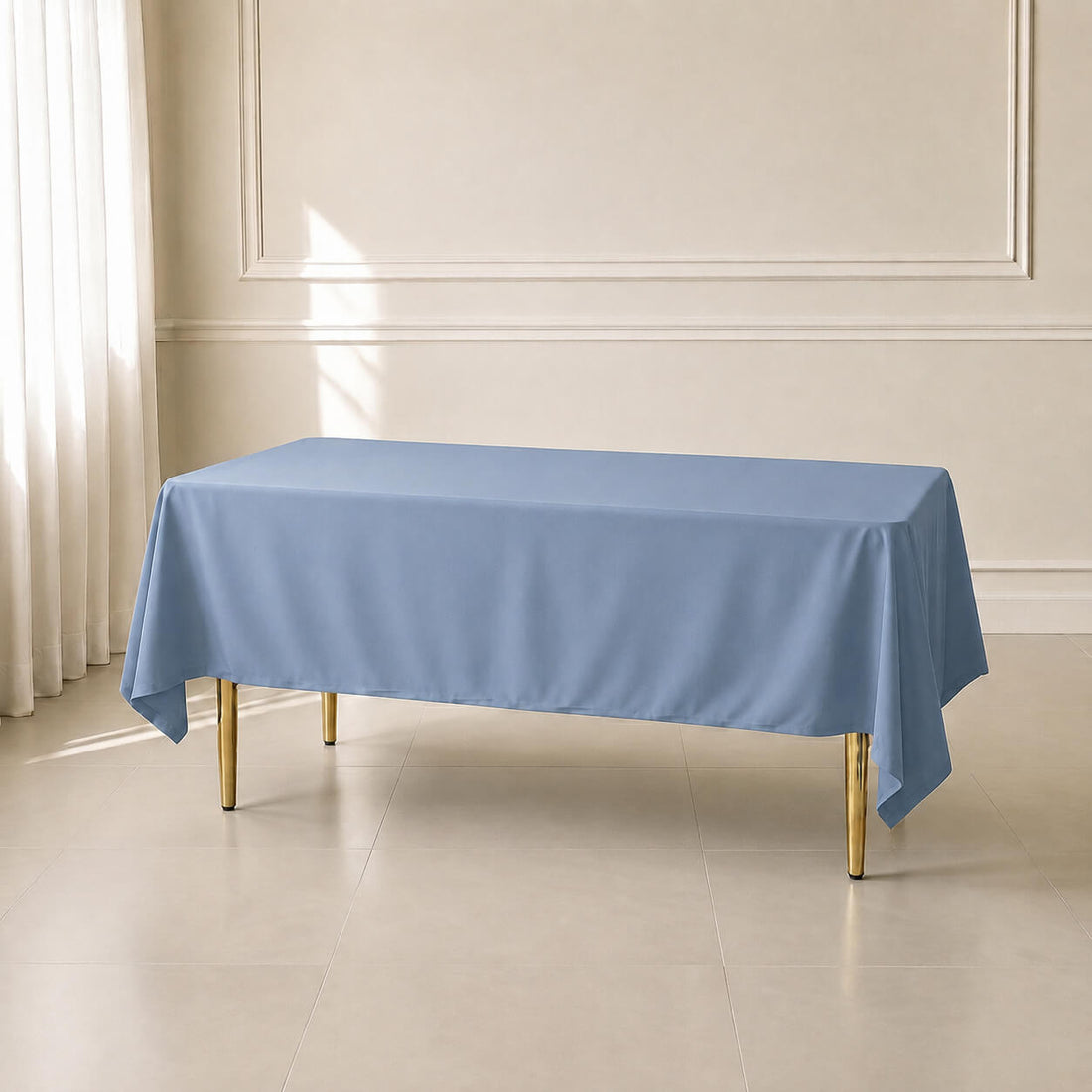 Dusty blue polyester rectangle tablecloth, 60"x102", wrinkle-resistant finish.