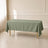 Dusty sage green polyester rectangle tablecloth on a dining table.