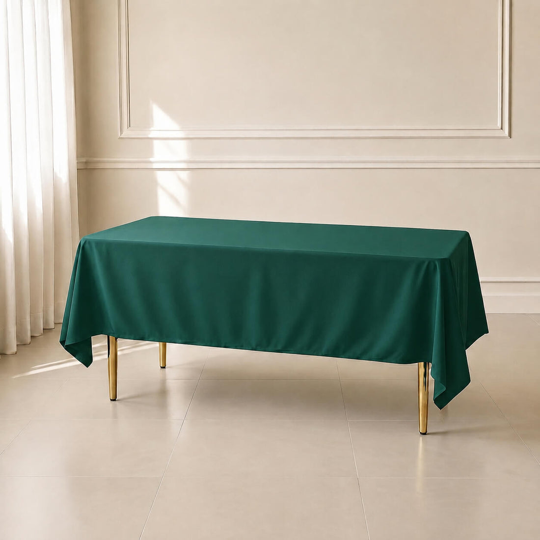 Hunter emerald green polyester rectangle tablecloth 60"x102" on a table.