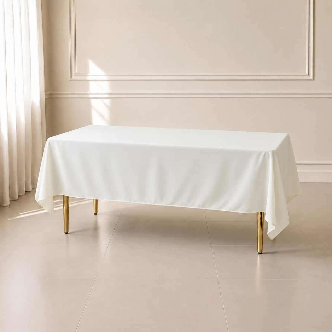 Ivory wrinkle-resistant rectangle tablecloth 60"x102" on a table.