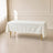 Ivory wrinkle-resistant rectangle tablecloth 60"x102" on a table.
