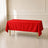 Red wrinkle-resistant rectangle tablecloth 60"x102" on a table.