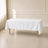 White wrinkle-resistant polyester tablecloth 60"x102" on a table.