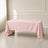 Blush rectangle tablecloth on a table in a bright, elegant setting.