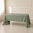 Dusty sage green rectangular tablecloth on a table.