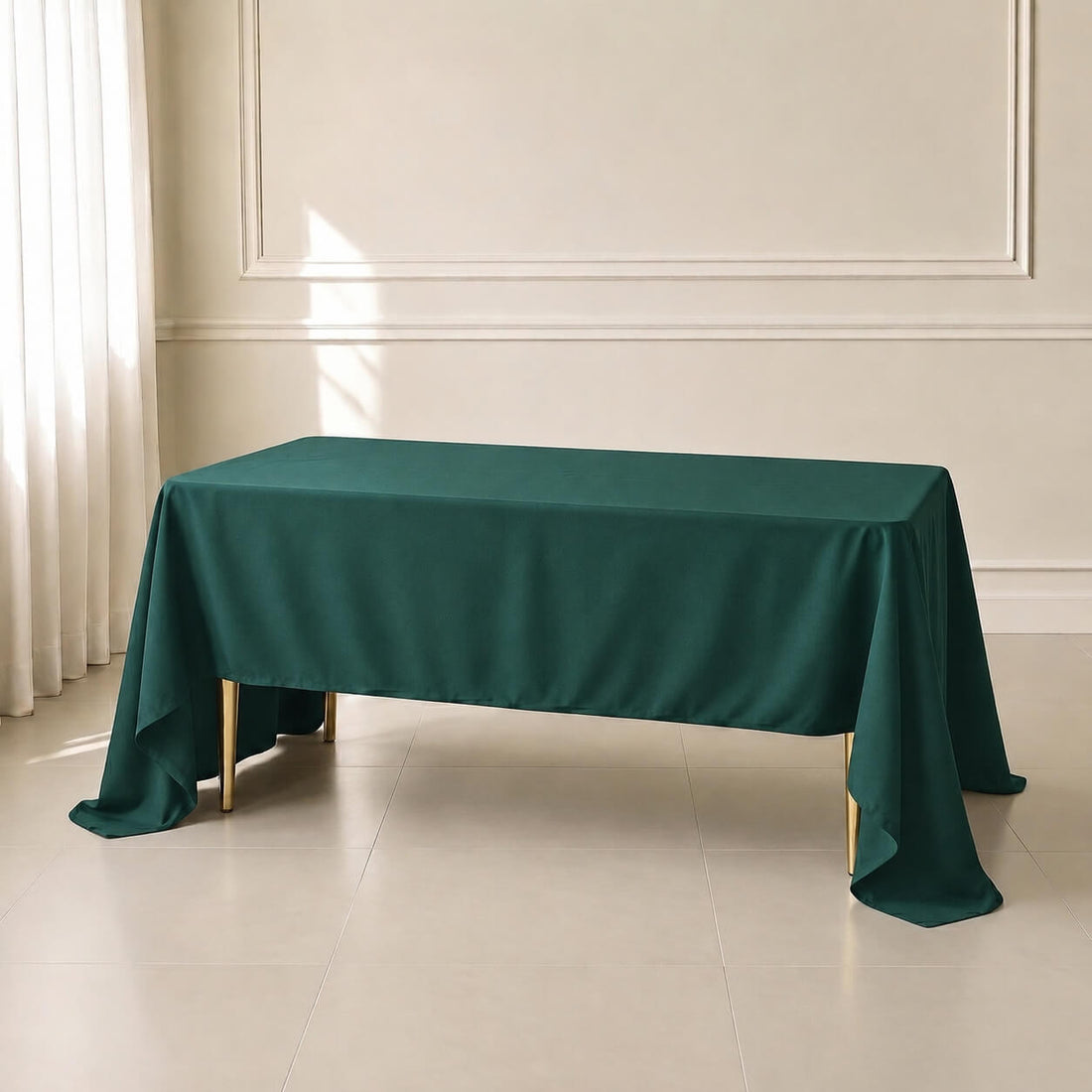 Hunter emerald green rectangle tablecloth on a table.