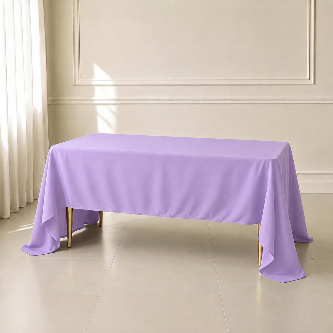 Lavender lilac rectangular tablecloth draped over a table in a bright room.