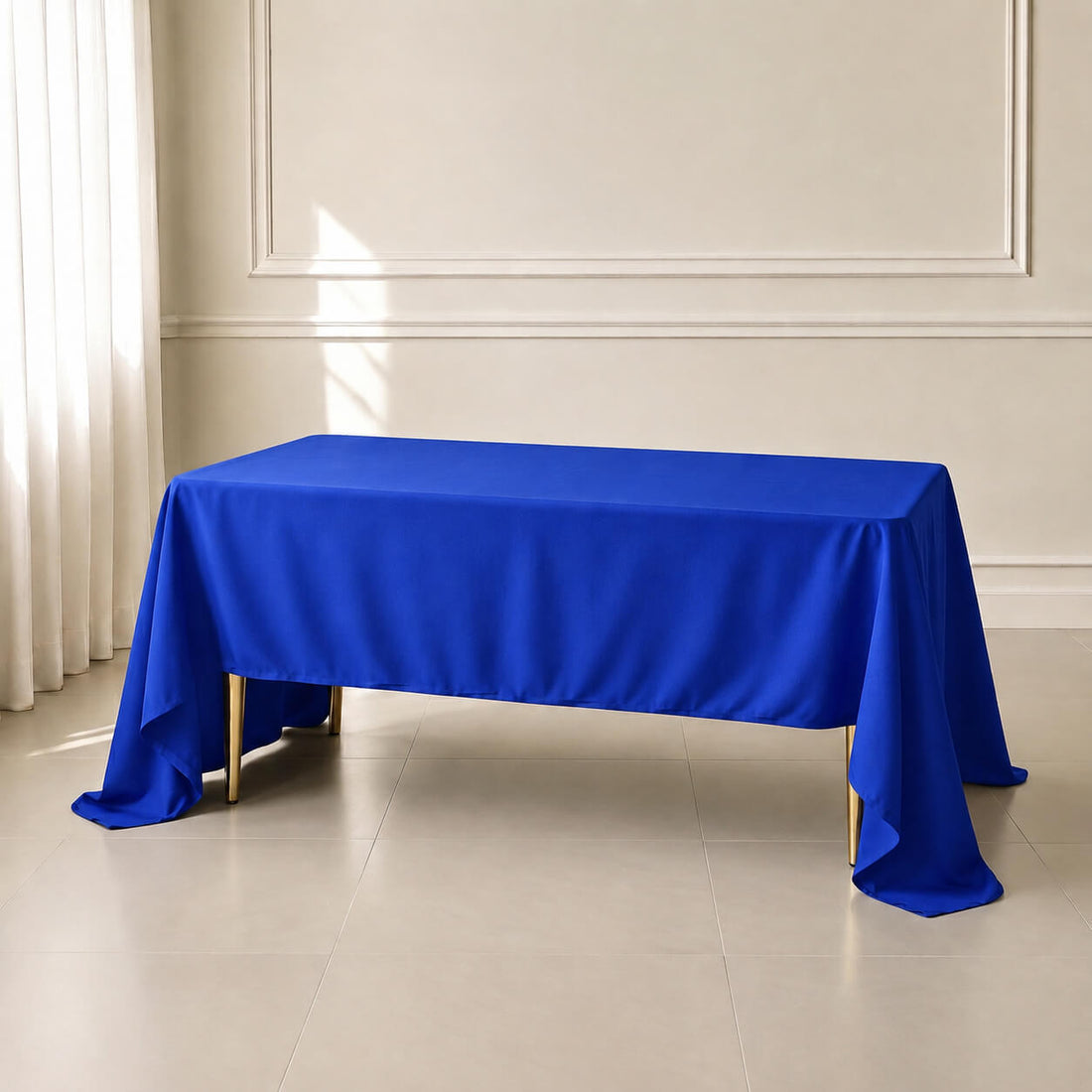 Royal blue polyester tablecloth 60"x126" on a table.