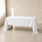 White polyester rectangle tablecloth on a table in an elegant setting.