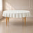 Ivory round tablecloth with a linen texture on a wooden table.