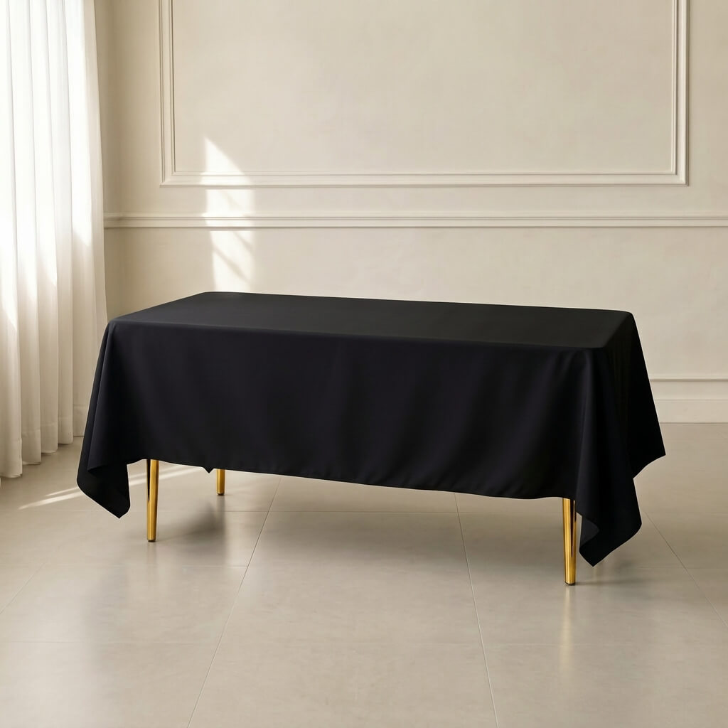 Black polyester rectangle tablecloth 72"x120" for weddings and events.