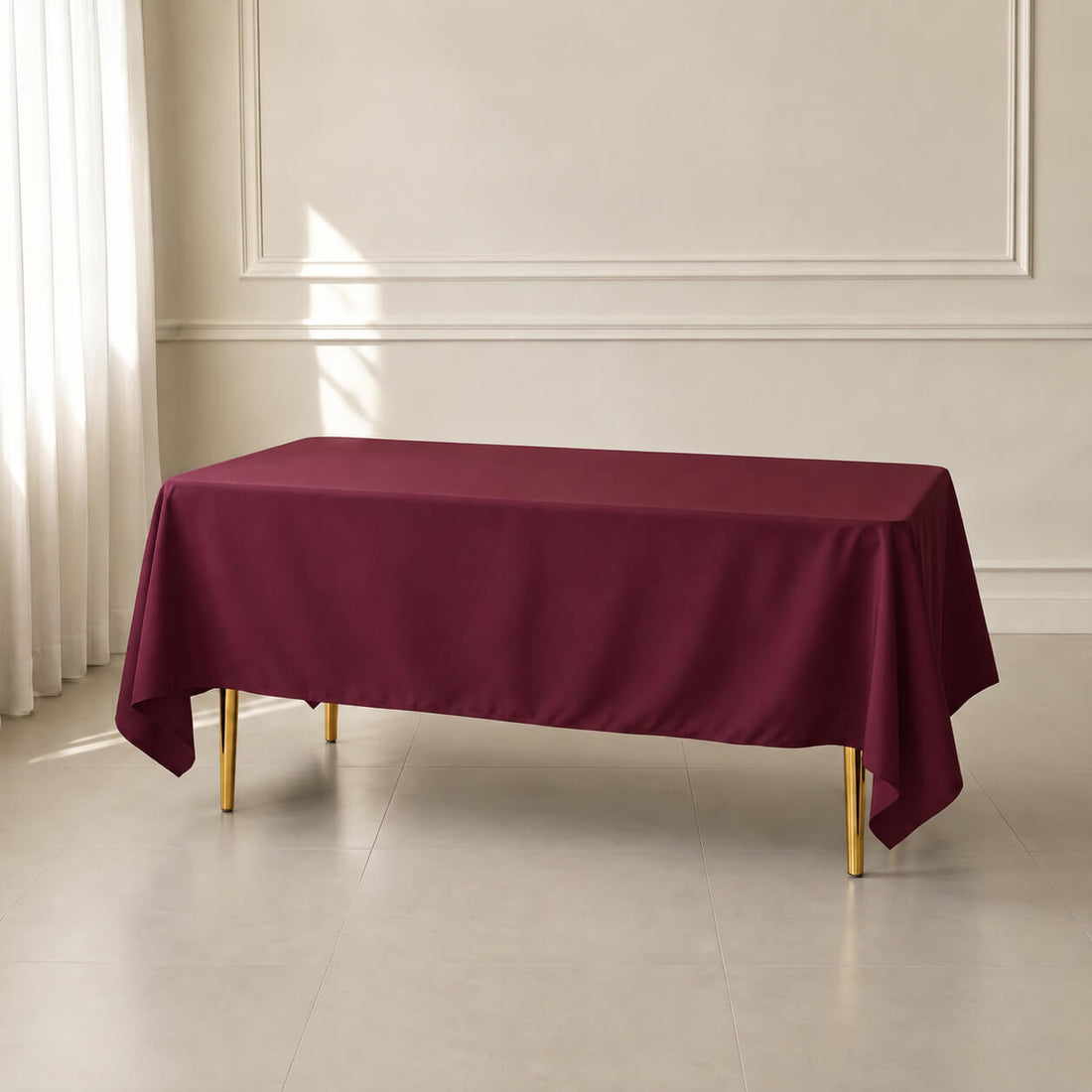 Burgundy rectangular tablecloth 72"x120" with wrinkle-resistant finish.